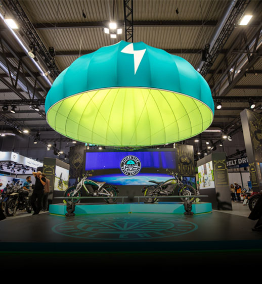 Electric motorcycles displayed at a motorcycle show